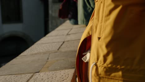 unrecognizable young tourist woman closing her backpack ready for next destination