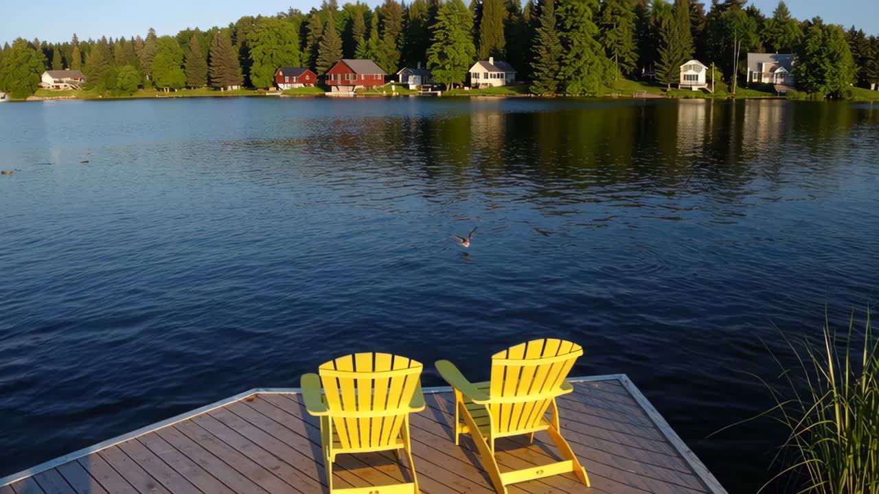 Tranquil Lake View with Yellow Adirondack Chairs on a Dock