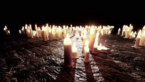 many lit candles on stone floor