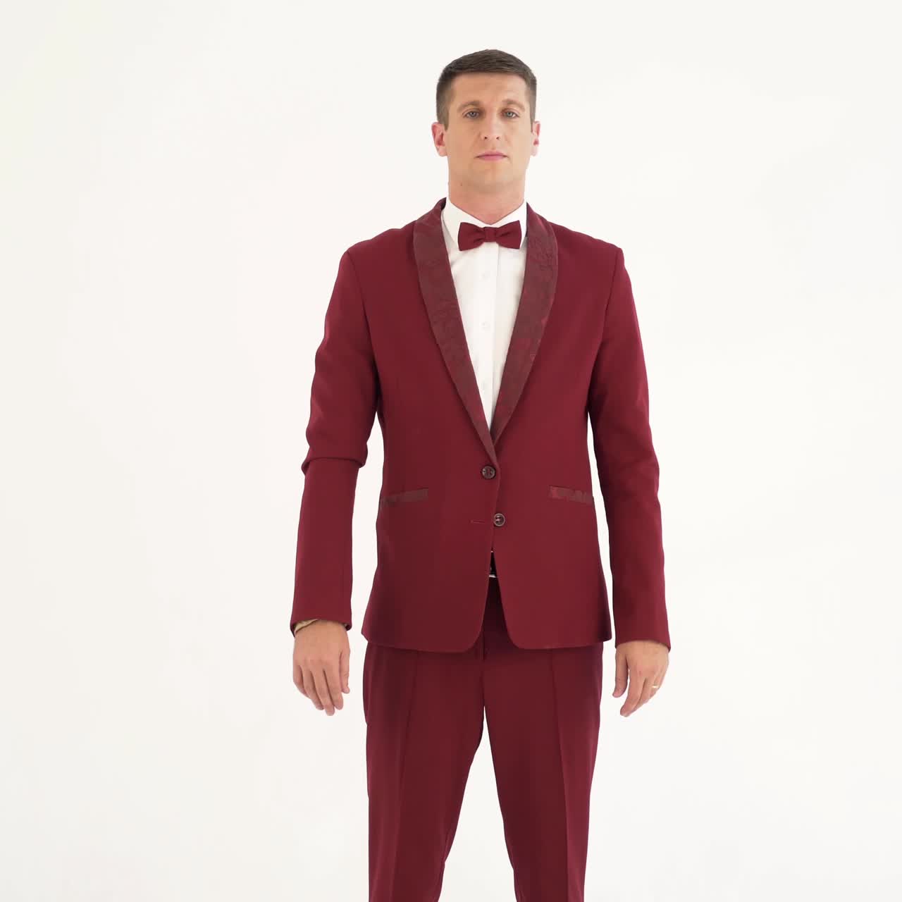 cheerful man in a red suit is making exercises with his hands on the sides on a white background. Caricature of a man who doing physical exercises