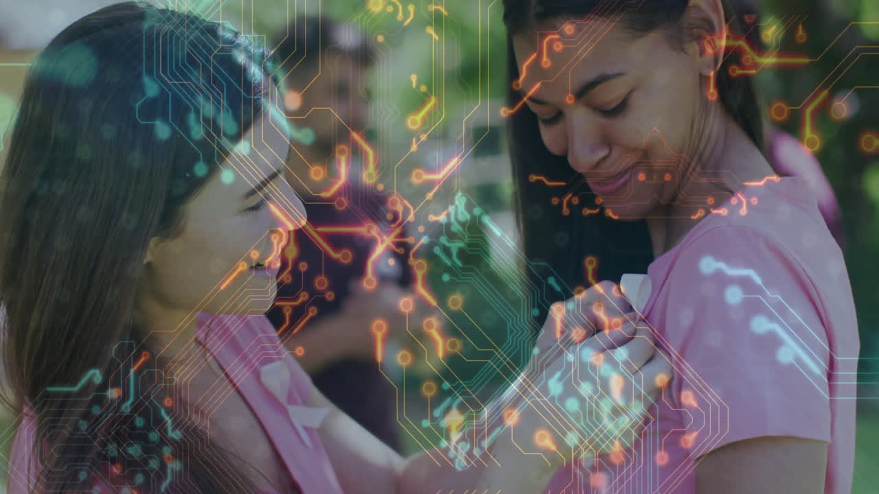 Two women interacting with circuit board animation overlaying their image