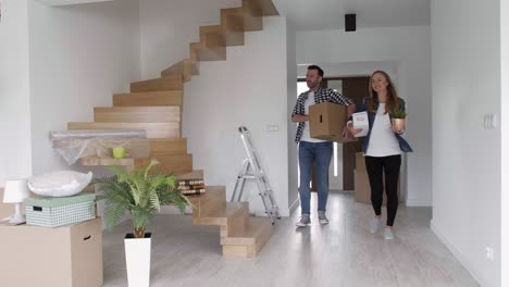 young couple moving in new apartment