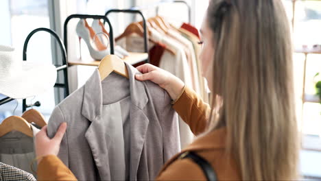 woman, customer and fashion with clothing rack