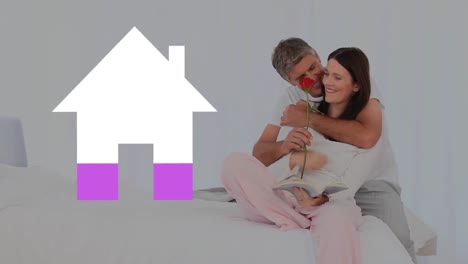 pareja romántica adulta y el icono de la casa llenando rosa