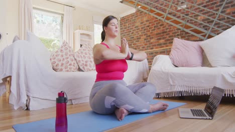 caucasian vlogger female exercising at home
