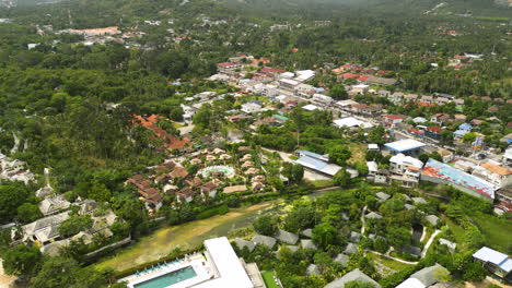 aerial top down shot of mae nam neighborhood on koh samui island during sunny day, thailand