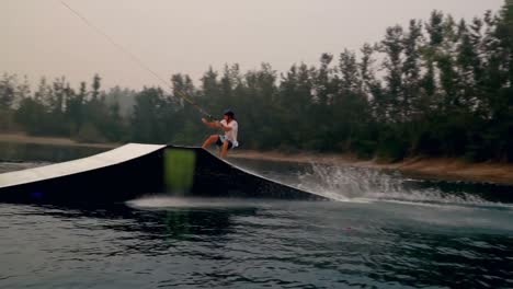 man wakeboarding in the river 4k