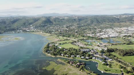 River-lagoon-and-surrounding-green-hills-of-Knysna,-South-Africa-aerial