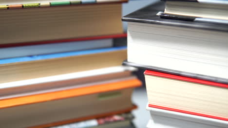 front of books lying on two stacks - top down camera move