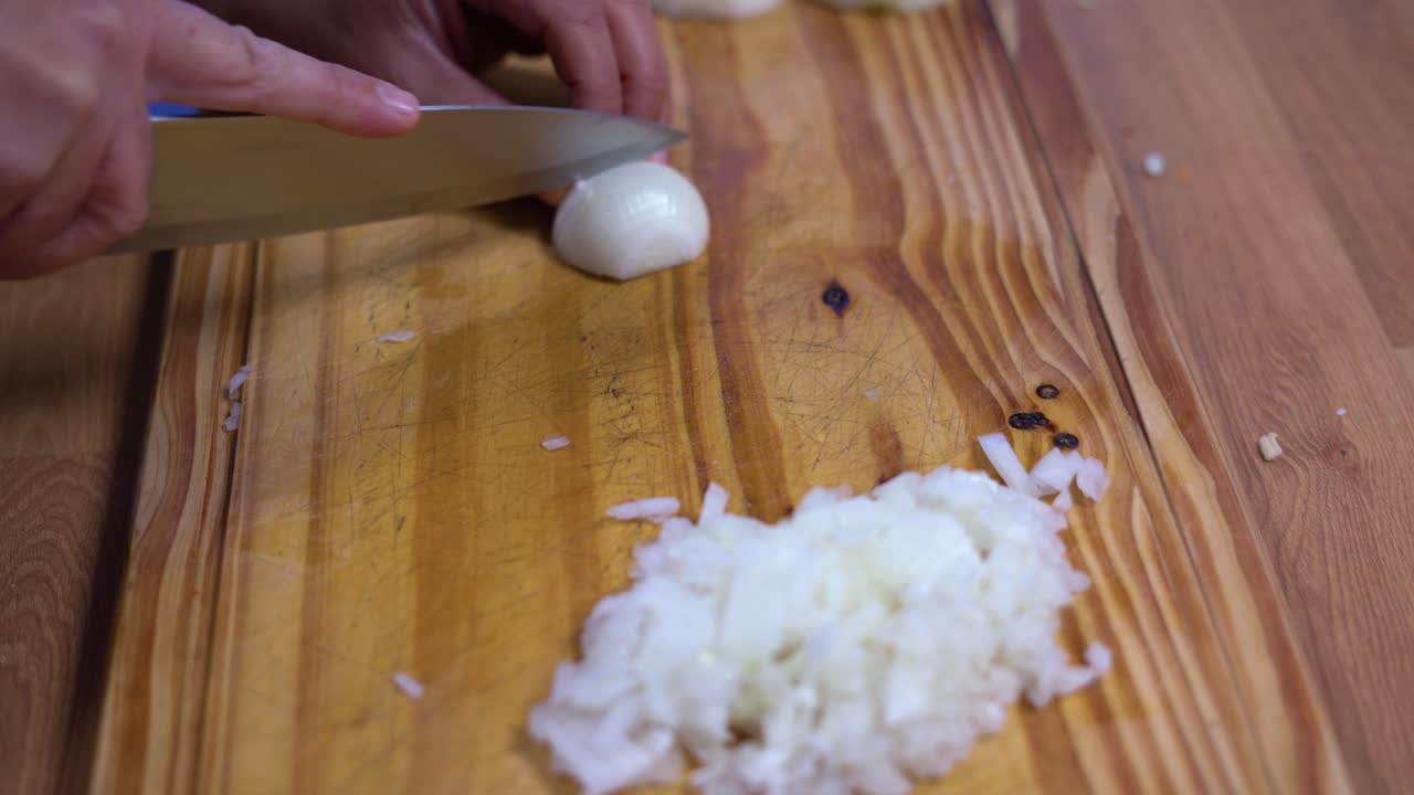 cutting minced garlic into julienne on wooden board kitchen healthy healthy diet
