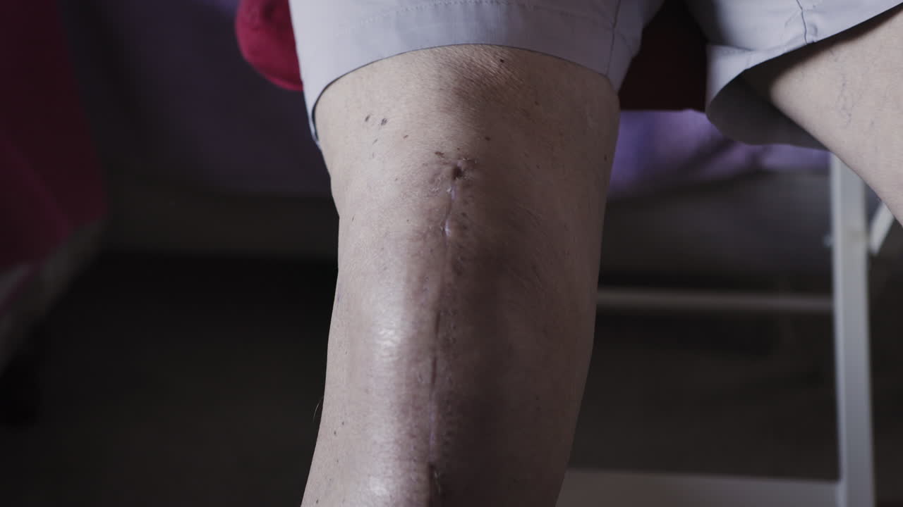 An elderly man sitting down