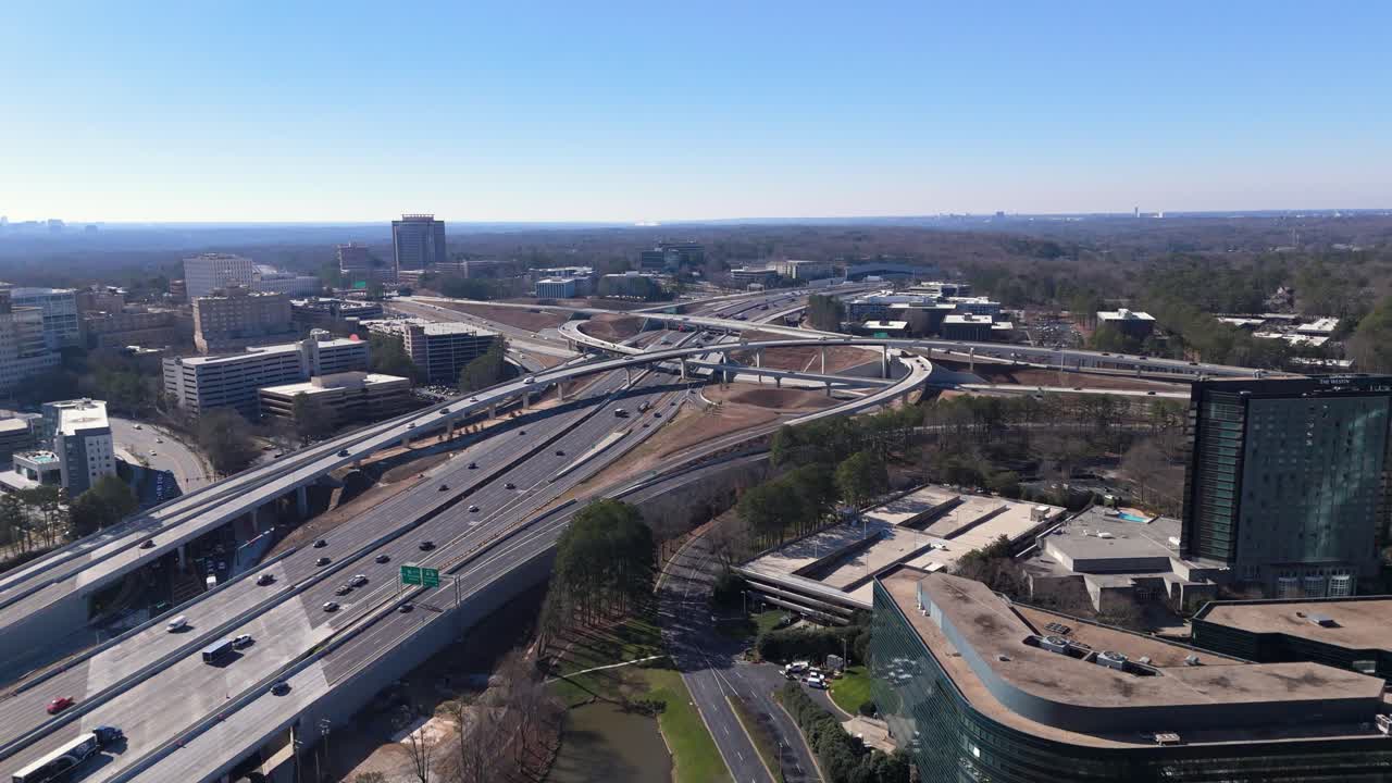 Drone shot pushing in on GA-400 and I-285 traffic.