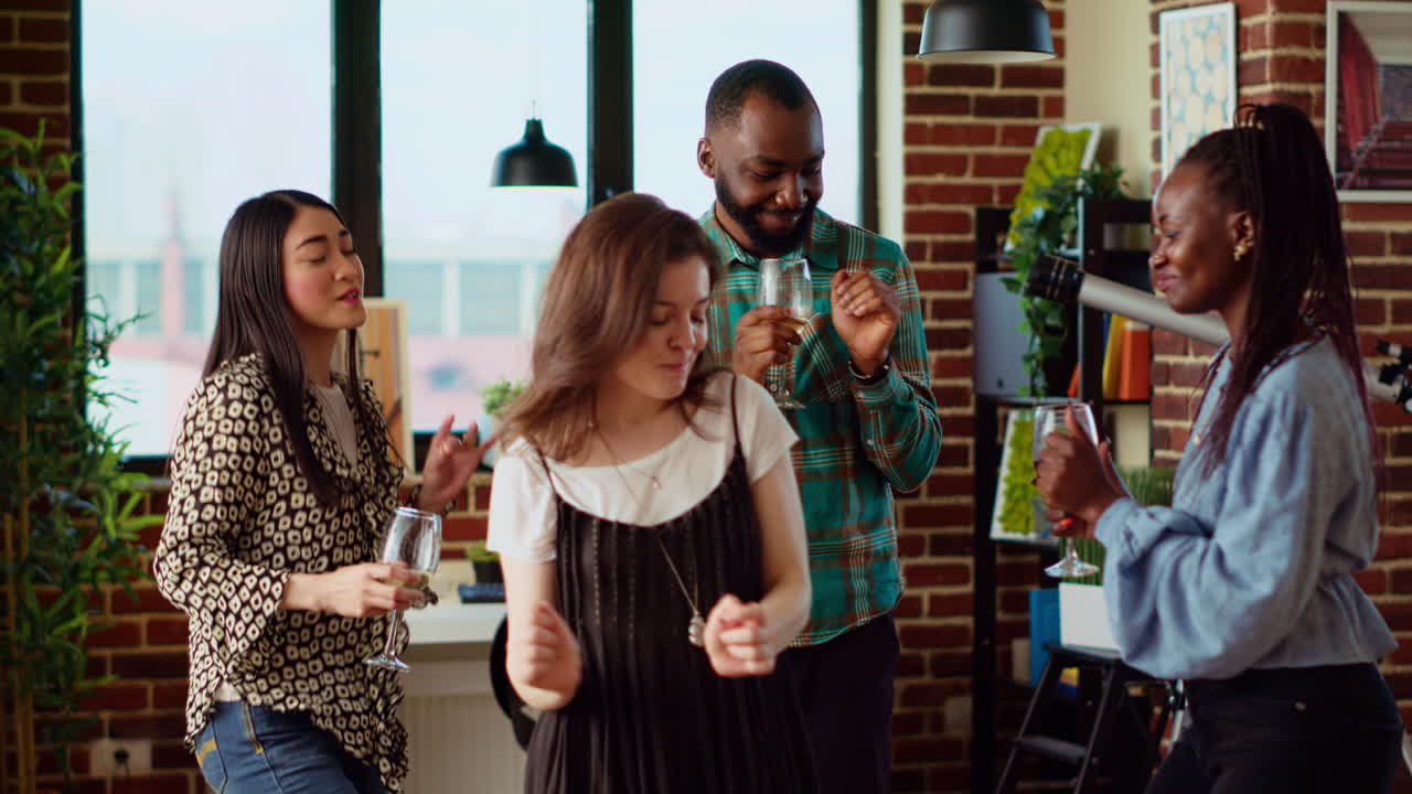 Friends enjoying time spent together, busting into skillful dance moves at social event