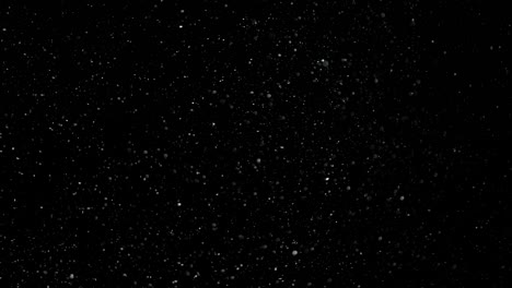 slow motion snow on black background