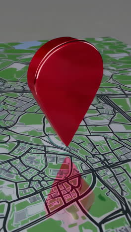 3d red location pin on a digital city map