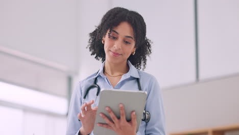 Tablet,-smile-and-woman-doctor-doing-research