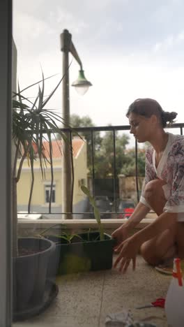 woman gardening on a balcony