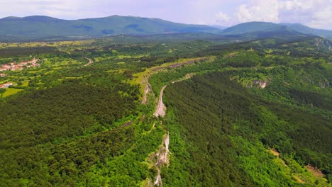 Stunning-aerial-4K-drone-footage-of-a-forest-with-railway-going-through