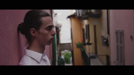 young man in an italian alley