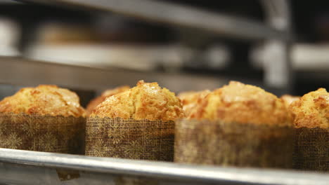 A-baking-tray-of-freshly-baked-muffins-at-a-bakery