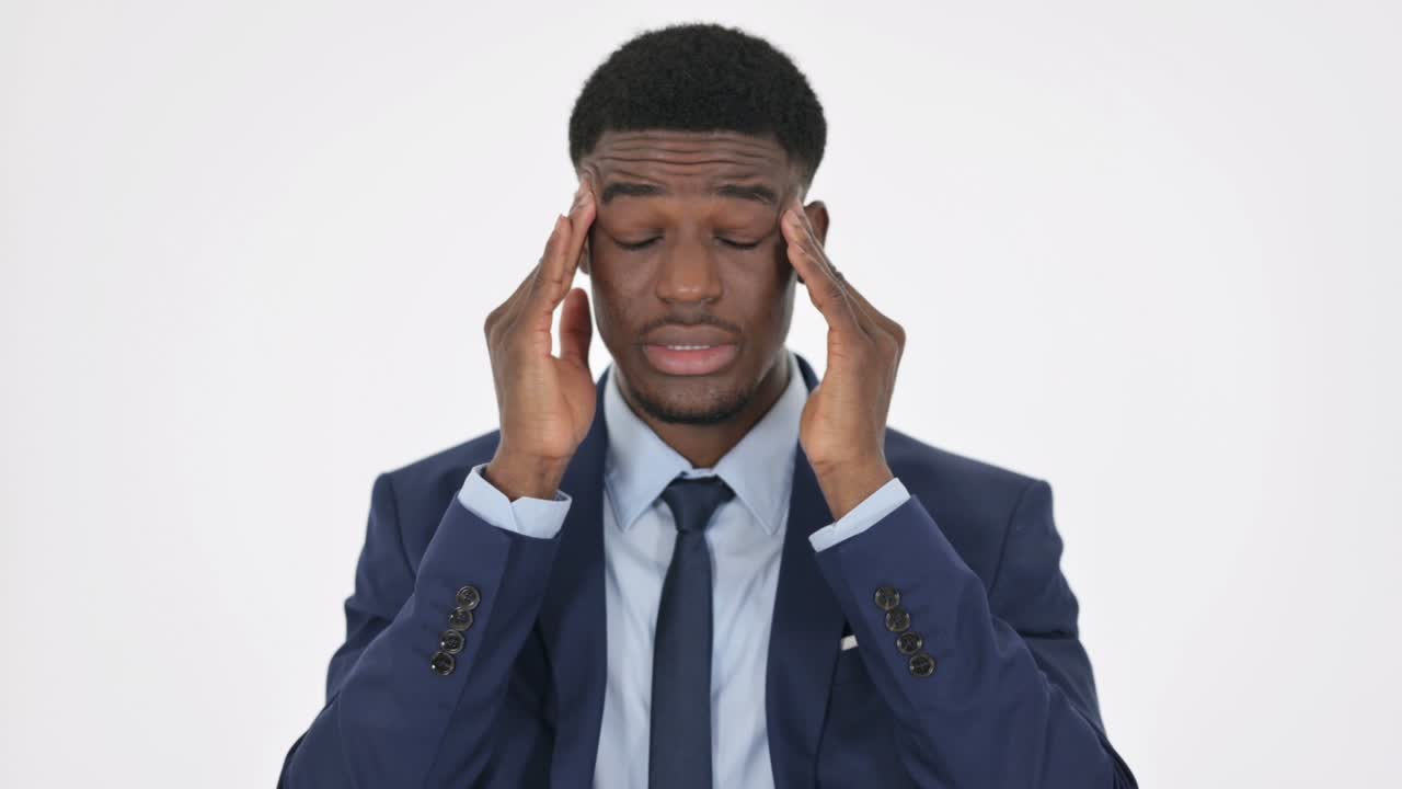 African Businessman having Headache on White Background