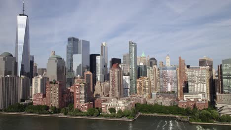 Aerial-view-approaching-high-rise-in-lower-Manhattan,-in-NYC,-USA---rising,-drone-shot