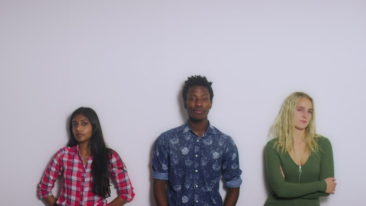 3 Young People Against a Wall Copy Space