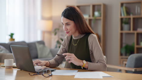 woman shopping online at home with a credit card