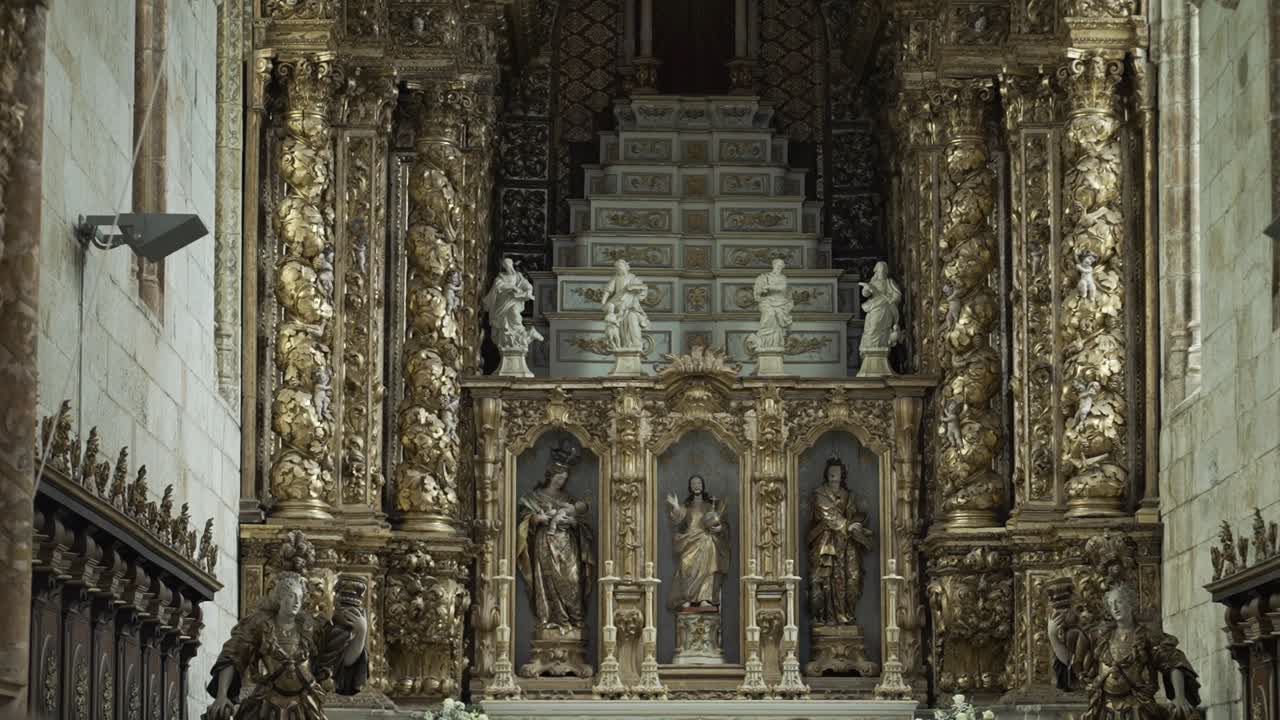 Elaborate gold Baroque altar with religious sculptures location irrelevant