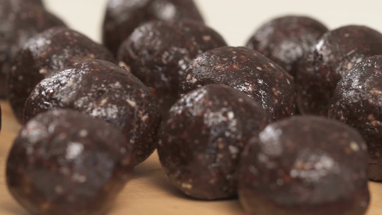 Left to the right shot of the chocolate candy balls. Dessert. Gourmet food.