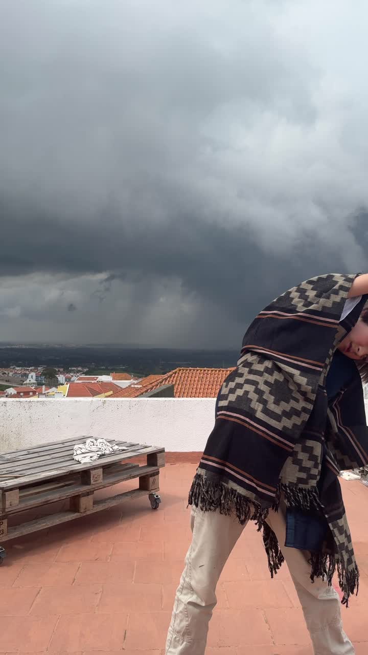 Teenager on a Rooftop during a Storm