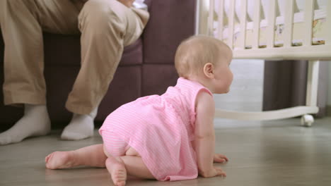 Baby-crawling-on-floor-at-home.-Sweet-childhood.-Toddler-walking-in-home