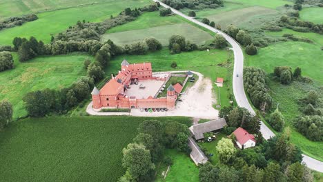 revealing, panoramic, aerial shot of the royal castle in tykocin, poland