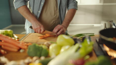 man chopping vegetables for cooking