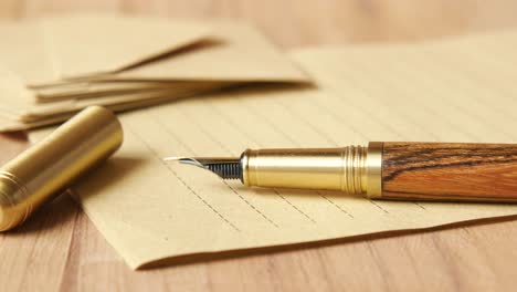 wooden fountain pen on lined paper