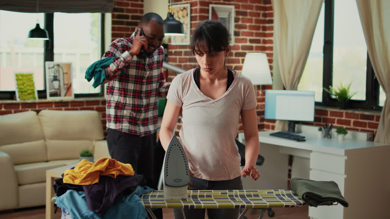 Mixed race couple having argument at home