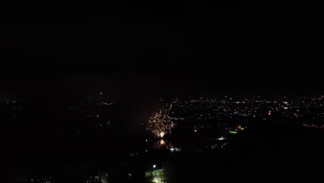 aerial shot of a vibrant firework display going off at new years eve for the new year