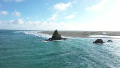 Scenic-Ninepin-Rock-with-lighthouse-on-top,-Huia-Reserve,-Auckland,-New-Zealand