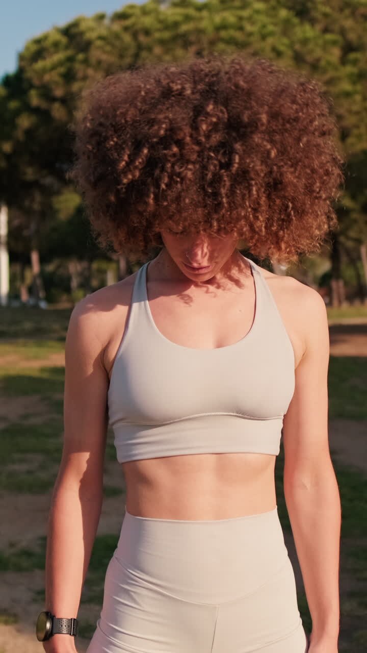 Woman Stretching Neck in Park Fitness