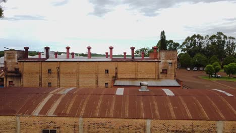 roof extractor fan and chimneys on the rooftop of yerba mate production plant in apostoles, misiones, argentina