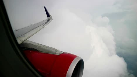 windows view of commercial airplane out of turbulence