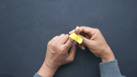 applying a bandage to a finger