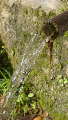 pipe with water stream falling down in slow motion, 4k120 slowed down to 4k24