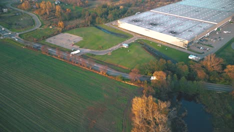 Aerial-view-of-warehouse-storages-or-industrial-factory-or-logistics-center-from-above