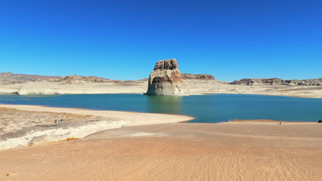 wahweap bay of lake powell with lone rock in summer in utah, usa. - aerial shot