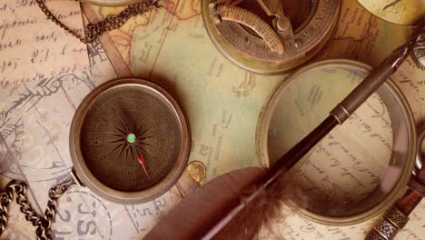 vintage style travel and adventure. vintage old compass and other vintage items on the table.