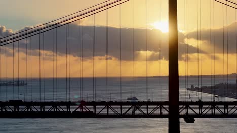 sunset sky over 25 of april bridge at lisbon in lisbon district portugal. sunset downtown. freeway road landscape. 25 of april bridge at lisbon in portugal. railroad scenery