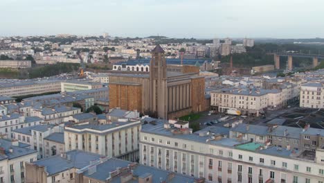 Orbiting-aerial-shot-over-buildings-in-coastal-city-Brest,-France