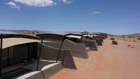 close up aerial view of some lodges near sossusvlei in namibian desert