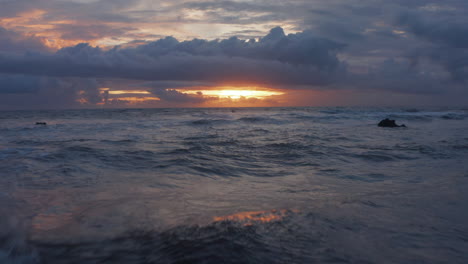 Close-up-view-of-blue-sea-waves-in-twilight.-Rough-ocean-waves-in-stunning-golden-sunset-light